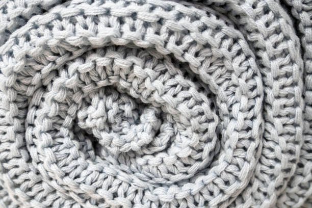 istock close-up of roll gray knitted plaid, soft selective focus 1142805845
