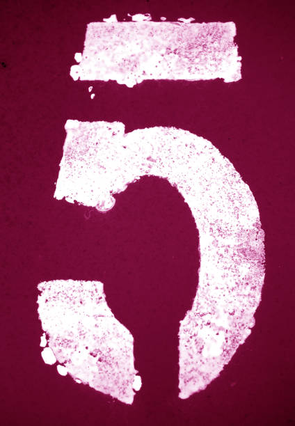 istock Number 5 in stencil on metal wall in pink tone 1142805862
