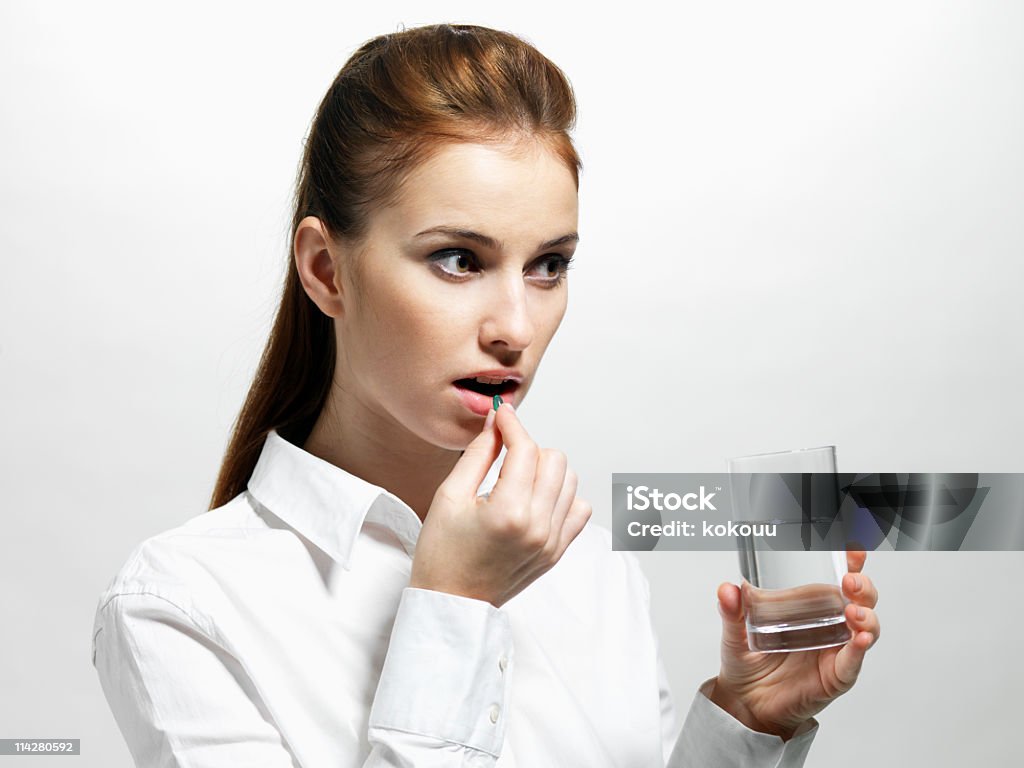 Female taking antibiotic. Women Stock Photo