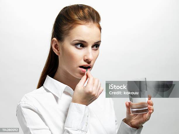 Female Taking Antibiotic Stock Photo - Download Image Now - Women, One Woman Only, Taking Medicine