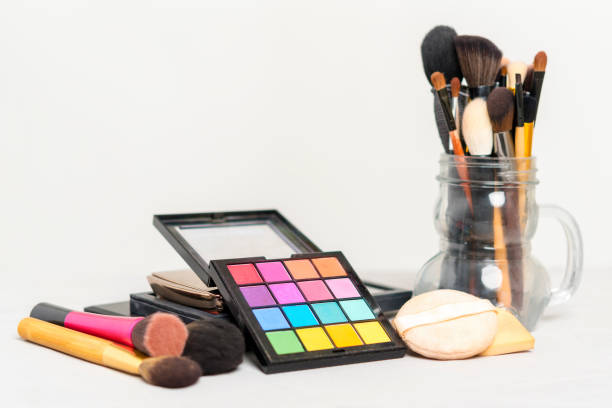 istock Makeup and beauty concept. Colorful cosmetic on plate with brushes on table. 1142806775