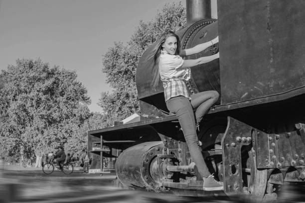 istock woman at the train station, old train 1142806942
