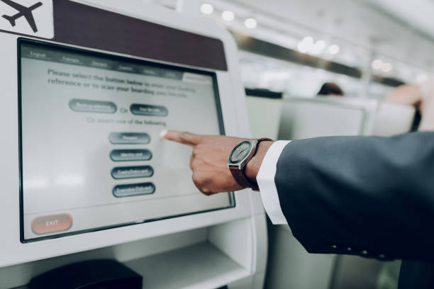 istock Man is using ATM machine at airport 1142807118