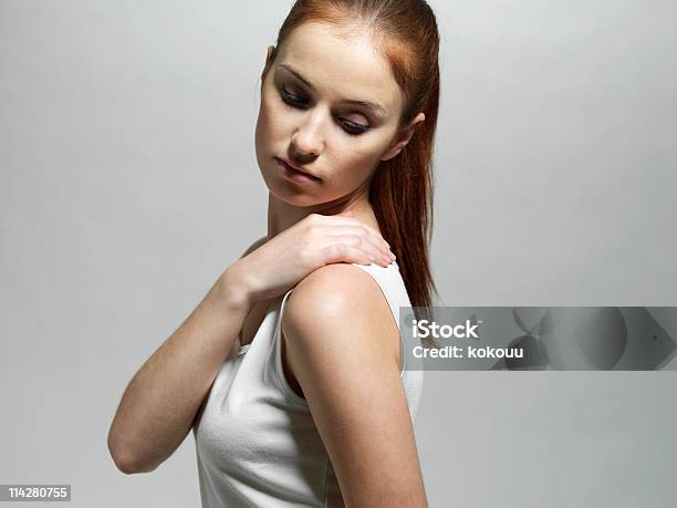 Young Woman With A Shoulder Massage Stock Photo - Download Image Now - Stiff Shoulder, Backache, Women