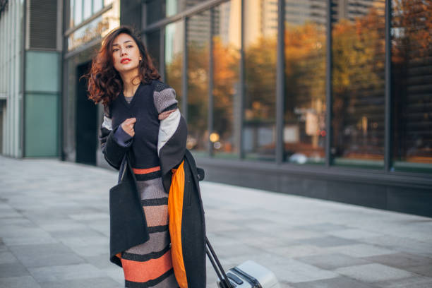 istock Lady with luggage waiting for a ride 1142808815