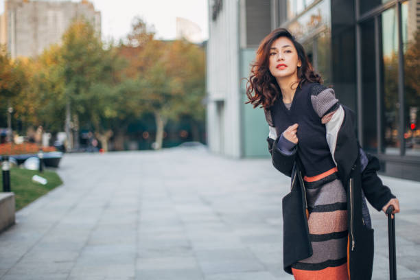 istock Woman with luggage waiting for a ride 1142808925