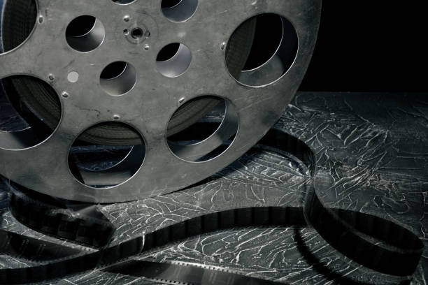 istock 35 mm film reel with dramatic lighting on a dark background 1142810541