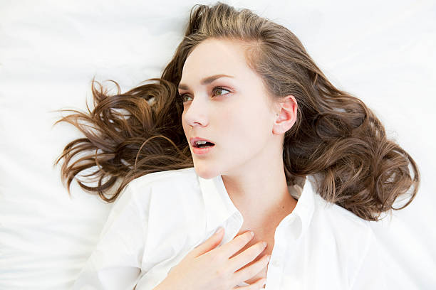 istock Young woman in bed 114281066