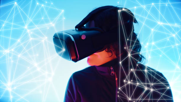 istock Virtual reality wearable headset girl using and graphic lines dots 1142810864