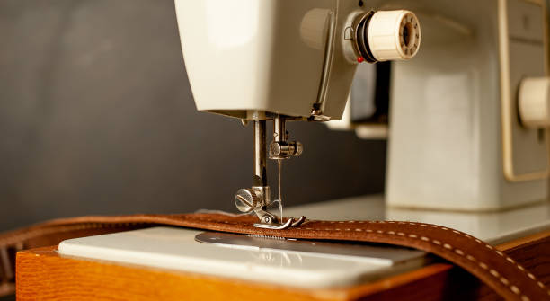 istock Background type of sewing machine, leather belt sewing process. Leather workshop. 1142813598