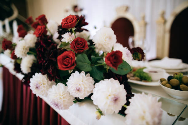 istock bouquet of red flowers on wedding table 1142813792