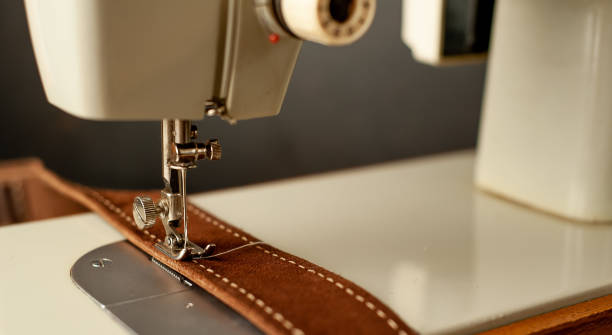 istock Background type of sewing machine, leather belt sewing process. Leather workshop. 1142813842