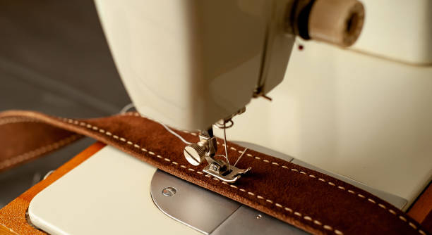 istock Background type of sewing machine, leather belt sewing process. Leather workshop. 1142813847