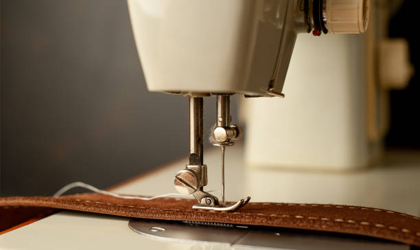 istock Background type of sewing machine, leather belt sewing process. Leather workshop. 1142813851
