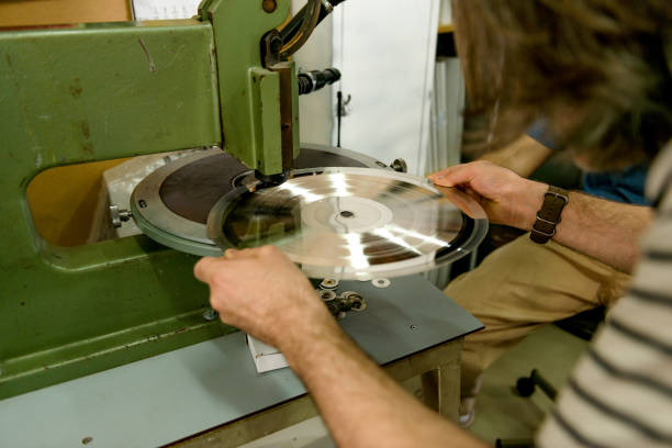 istock Young man working in a vinyl factory 1142814181