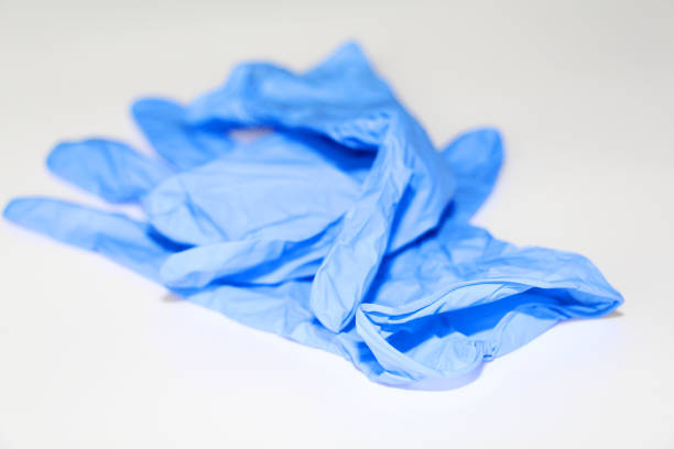 istock Latex sterile gloves lie on a white background. 1142815552
