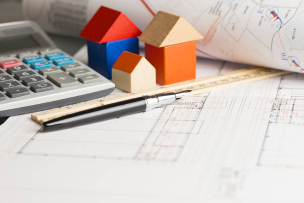 istock Plans and calculation for a new house or real estate project 1142815724