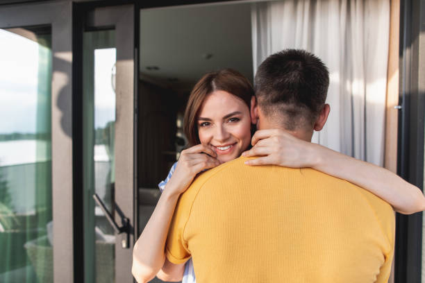 istock Joyous young woman hugged by her man 1142817355
