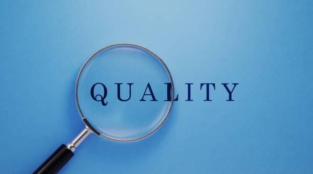 istock Quality Concept - Magnifier And Quality Text On Blue Background 1142818570