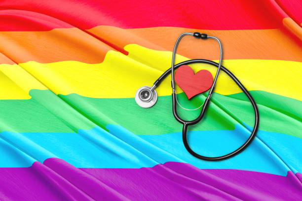 stethoskop und herzform - lesbian gay man rainbow multi colored stock-fotos und bilder