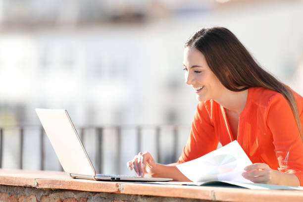 istock Happy entrepreneur working with laptop and charts 1142820662
