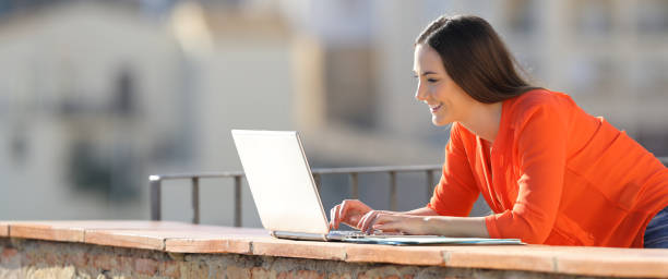 Entrepreneur working with a laptop in a balcony