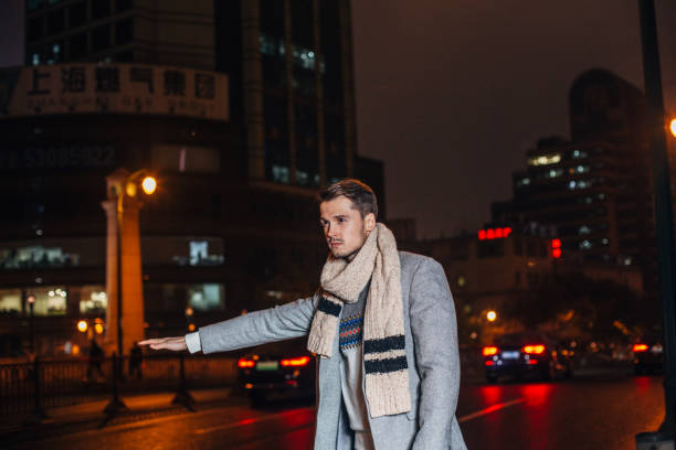 istock Gentleman catching a ride downtown at night 1142822760