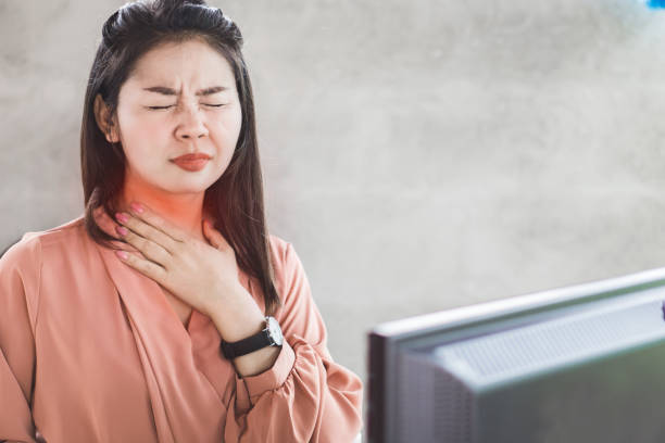 istock Asian woman suffering from acid reflux or heartburn 1142823376
