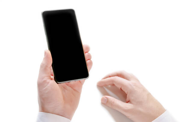 istock Unrecognizable man holding smartphone with black blank screen isolated on white background. 1142823412