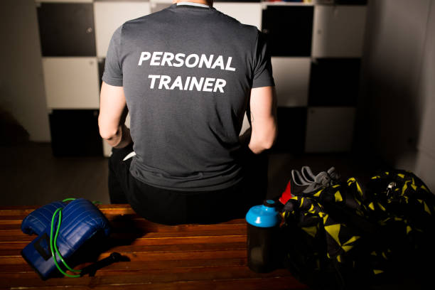 istock Personal trainer in a locker room is getting ready to start his job 1142823601