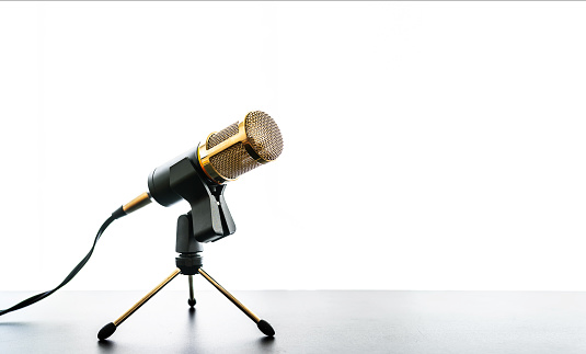 low angle view of microphone on table against white background
