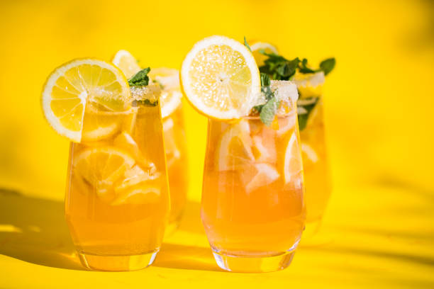 istock homemade lemon lemonade on yellow background 1142824922