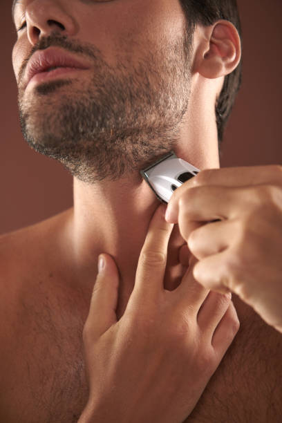 istock Young guy shaving his bristle on face 1142825590