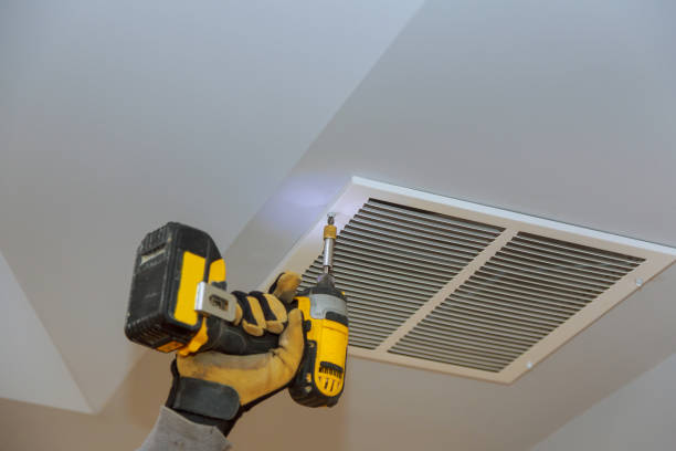 The process of installing mounting skin ceiling covered by ventilation cover The process of installing mounting skin ceiling covered by metalic ventilation cover in under-construction site. wall mounted air conditioner stock pictures, royalty-free photos & images