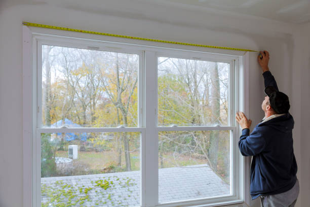 istock Process for under construction measuring and nailing moldings on the window in a new home 1142825661