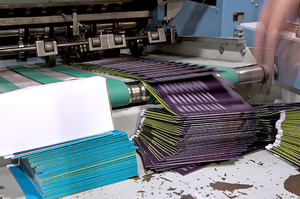 Folding Machine in Motion...  printing out stock pictures, royalty-free photos & images