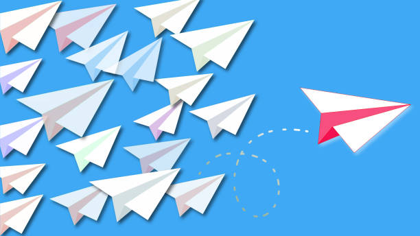 istock Smart red paper plane leaves the flock to achieve success 1142829526