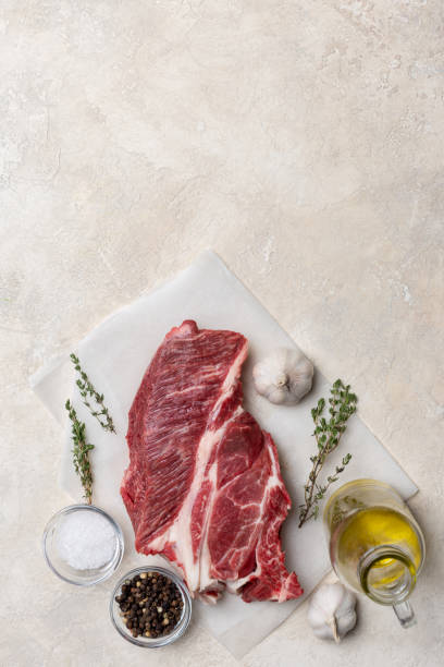 istock Vertical free space with fresh meet and herbs and spices 1142829667
