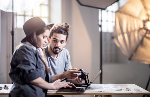 istock Two Photographers Working in The Studio 1142831181
