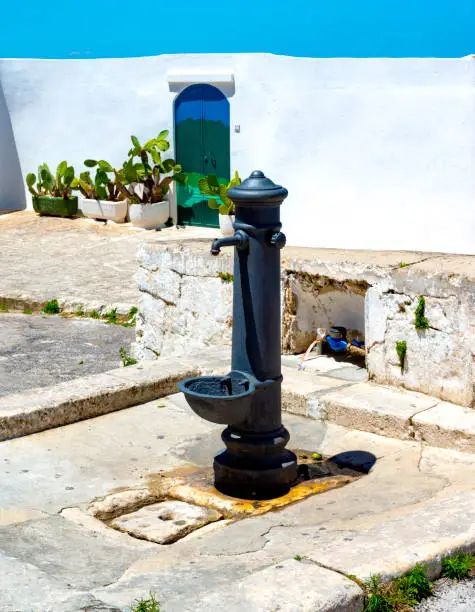 Photo of Old fountain in Ostuni Old town. Apulia.