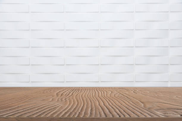 istock Abstract background from empty wooden tabletop for show product with white marble wall background. 1142832488
