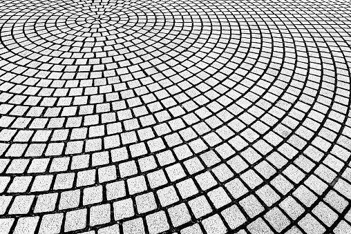 Abstract background from brickwork pattern decorated on floor in curve shape.