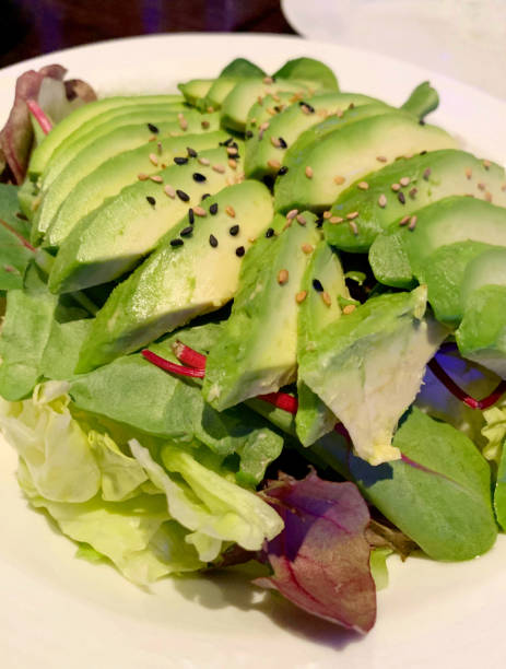istock Sliced Avocado Salad with Sesame Seeds 1142835487