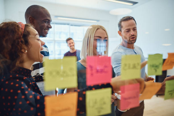 istock Team of designers smiling during an office brainstorming session 1142835807