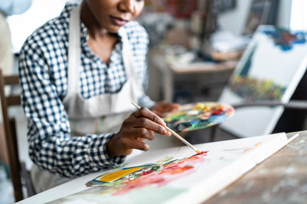 istock Female artist working in studio 1142835874