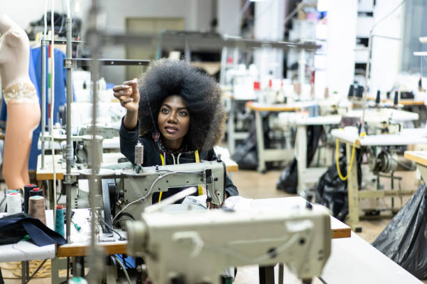 istock Young afro woman in sewing workshop 1142836478