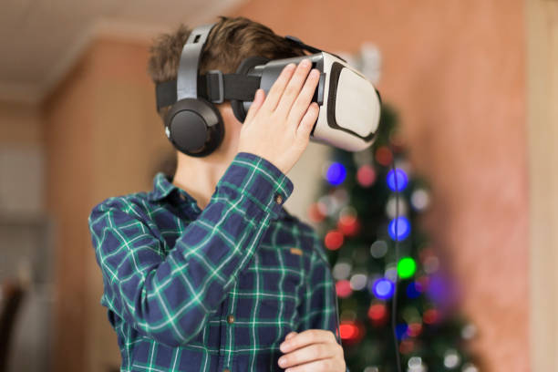 istock Portrait of excited boy is using vr device 1142836610