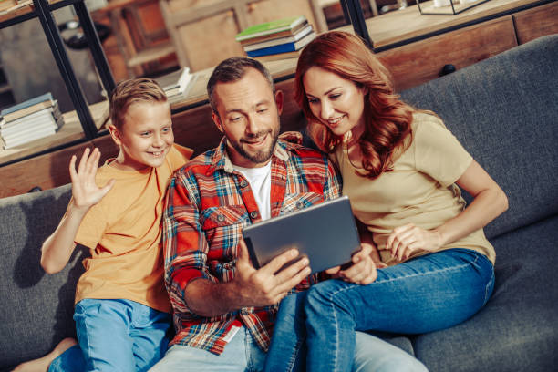 istock Communication through internet with relatives and friends 1142838246