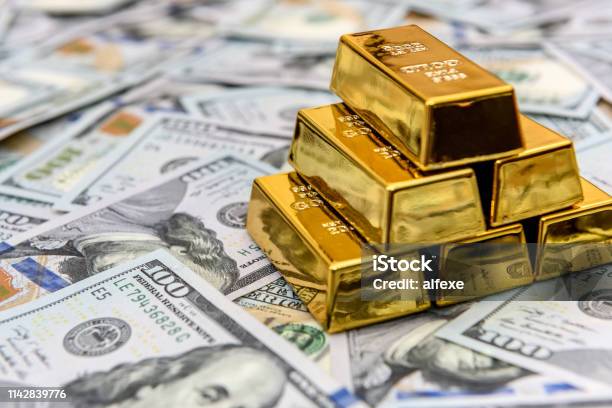 Gold Bullion On American Dollar Banknotes Close Up Stock Photo - Download Image Now - Gold - Metal, Ingot, Currency