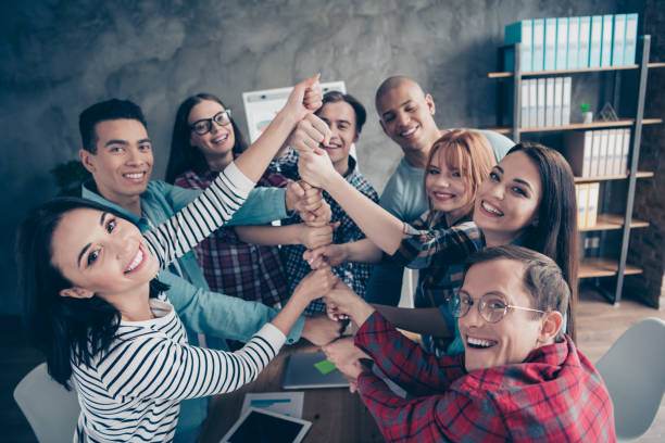 istock Joyful positive managers partners partnership coworking cooperating unity community enjoying dressed casual shirts in cozy boardroom office 1142840258